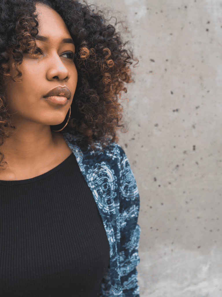 Somber woman wanting to know more about beating the winter blues