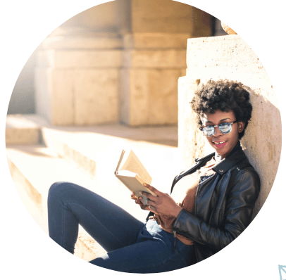 Tip #3: Woman reading a book and happy 